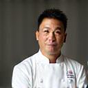 Portrait of Chef Kenji Tanaka, a renowned chef.